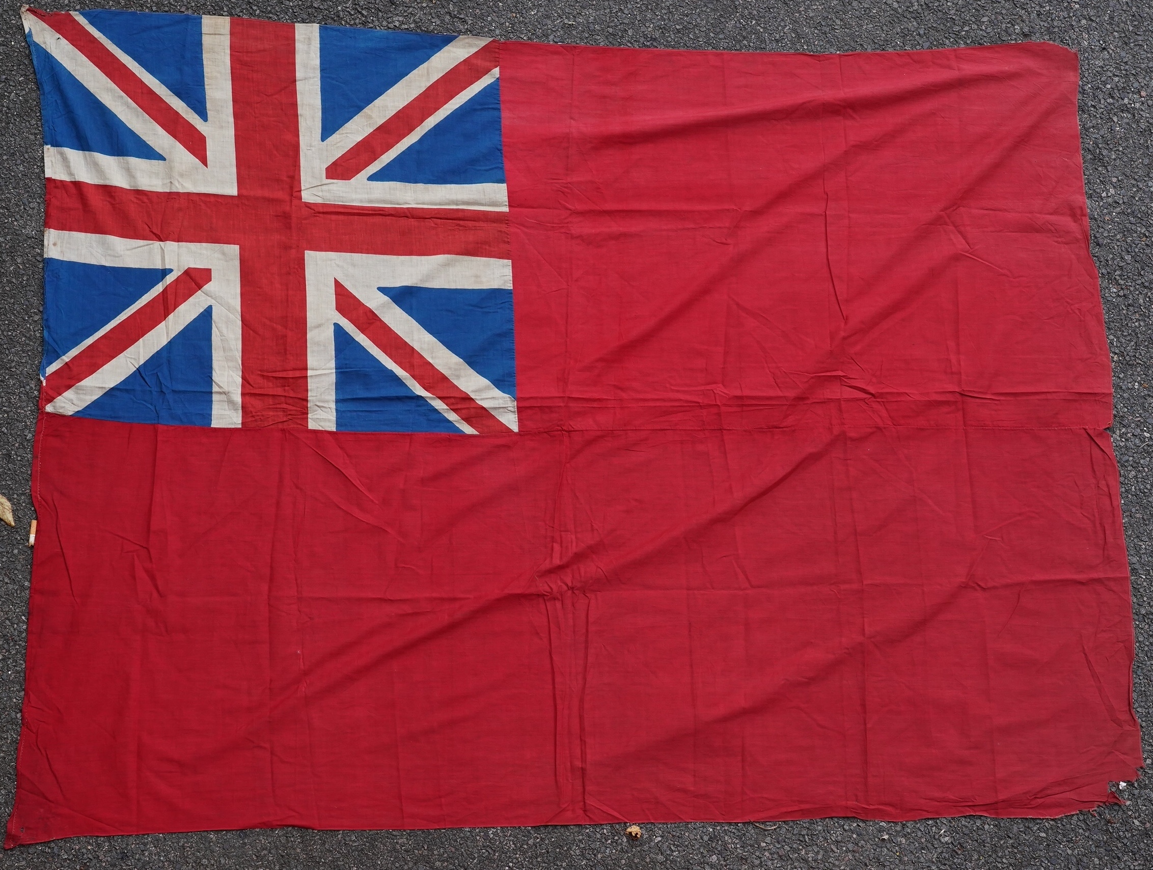 Four flags; two professionally made US Stars and Stripes, both on thick canvas with applied stars and joined stripes, one by the Valley Forge Flag Co., Pennsylvania, stamped “5 x 9.5 ft”, 146 x 288cm and 176 x 300cm, tog